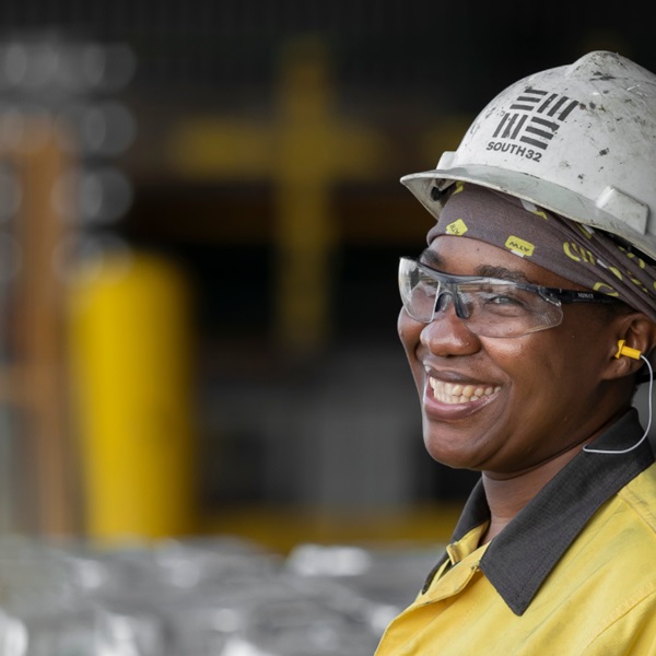 lady smiling in her south32 uniform